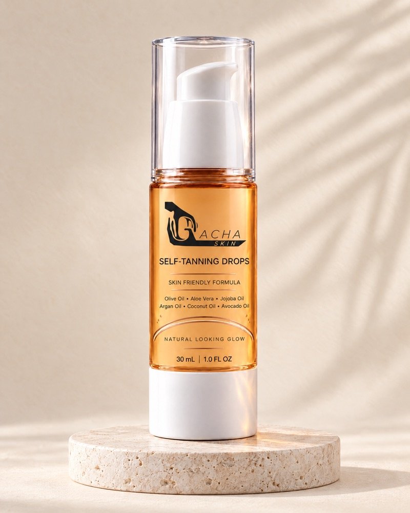 The Gacha Self-Tanning Drops bottle on a travertine disc, showing its clear overcap, white pump, amber body with black label and white base.